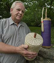 The Rev. Brian Bergin holds the fireworks shell that contains his father's (Rev. George Bergin) ashes. 